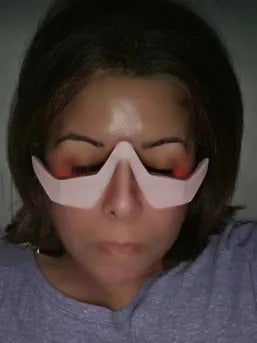 A customer wearing the device at home