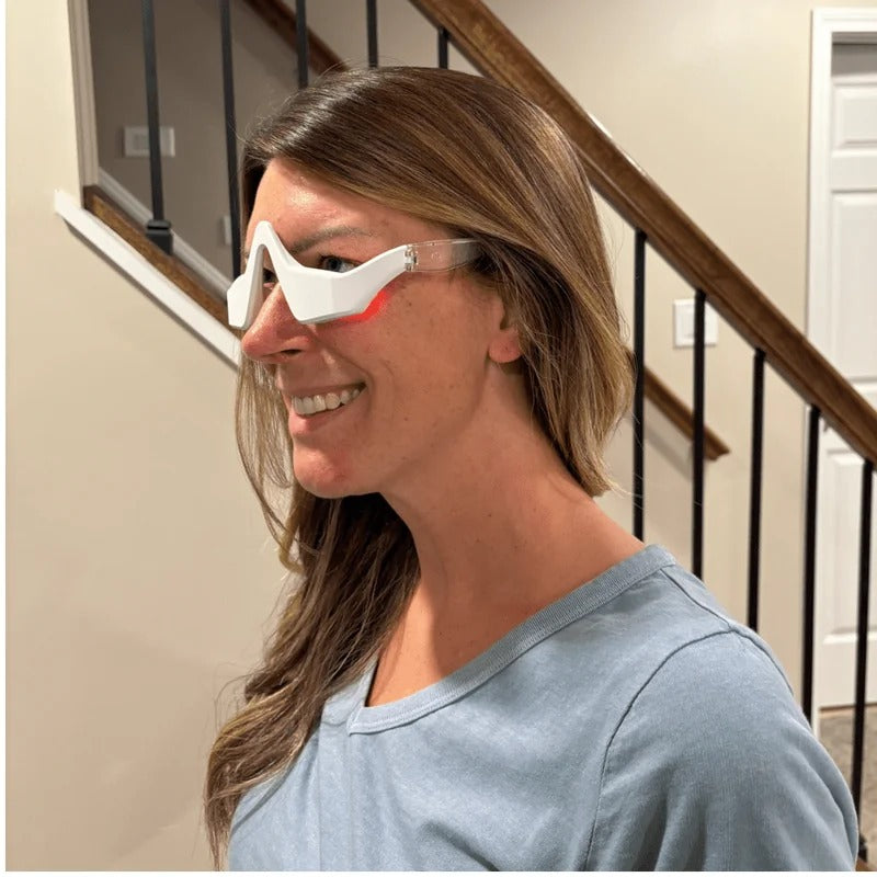 A customer wearing the device with the red light on, side profile